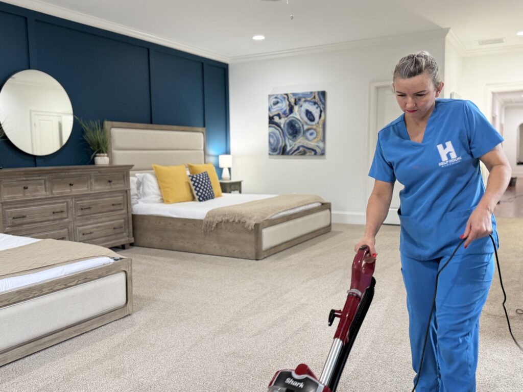 Help House Cleaning professional cleaning a bedroom in San Mateo